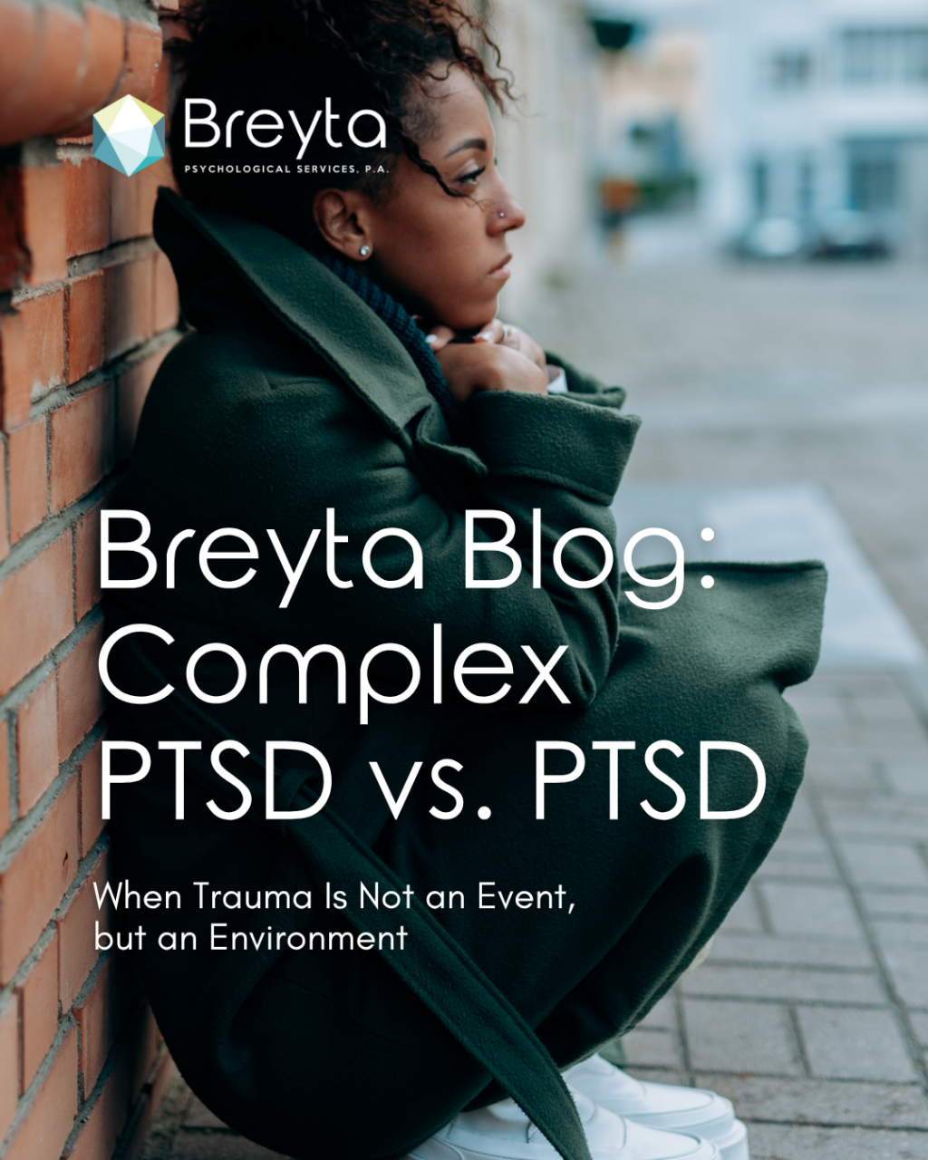 Distressed woman squatting and leaning against building. Overlay text showing the difference between complex PTSD vs PTSD and how trauma can be an ongoing environment.